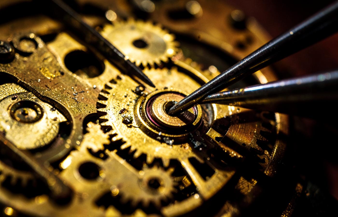 Close-up of a clock movement being serviced with precision tools